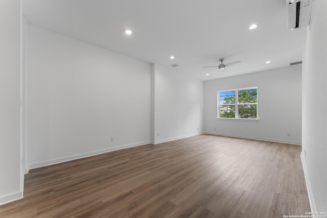 unfurnished room with ceiling fan and dark wood-type flooring