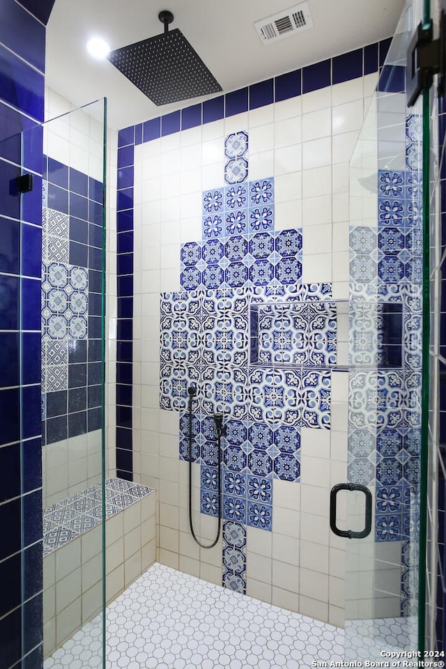 bathroom featuring an enclosed shower