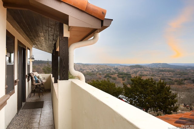 balcony at dusk with a mountain view