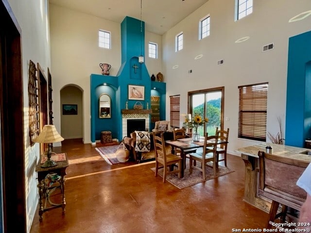 dining area with a high ceiling