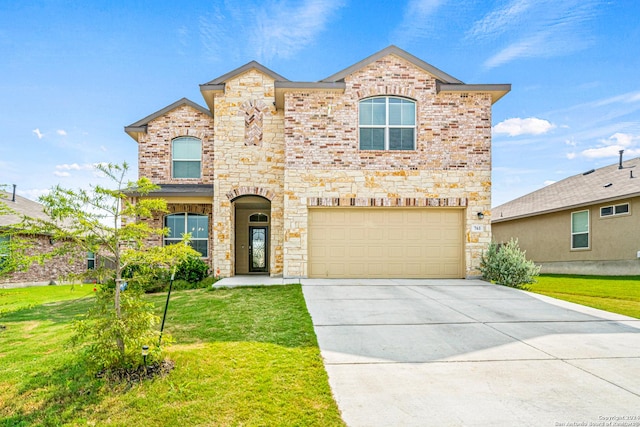 view of front of property with a garage and a front lawn