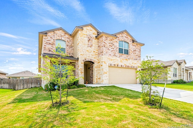 view of front of property with a garage and a front yard