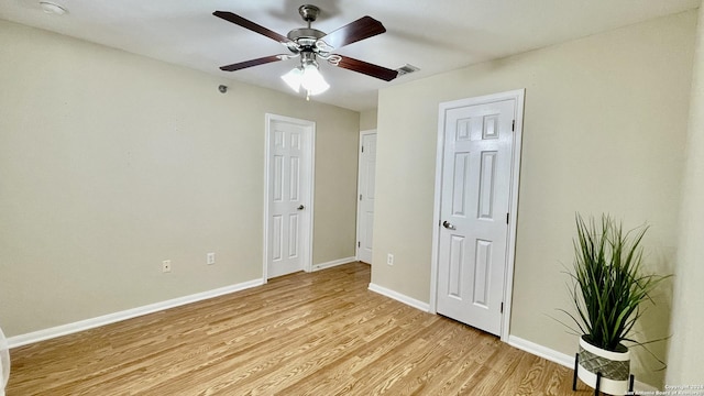 unfurnished bedroom with light wood-type flooring and ceiling fan