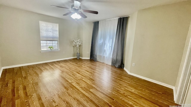 unfurnished room featuring hardwood / wood-style floors and ceiling fan