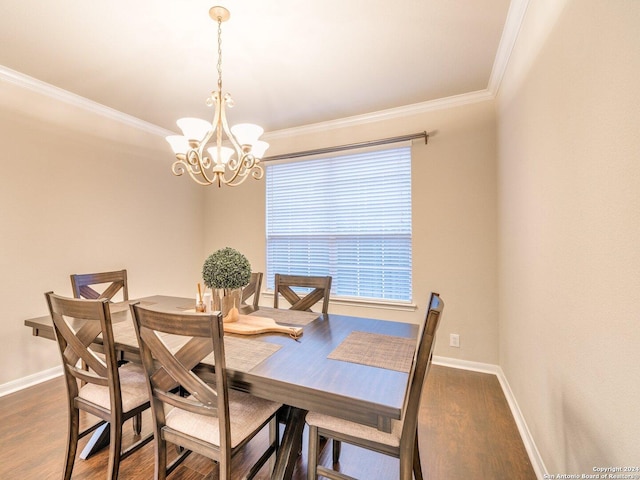 dining space with a notable chandelier, dark hardwood / wood-style floors, and crown molding