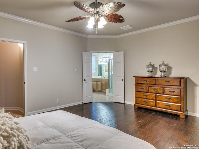 bedroom with ceiling fan, dark hardwood / wood-style flooring, crown molding, and connected bathroom