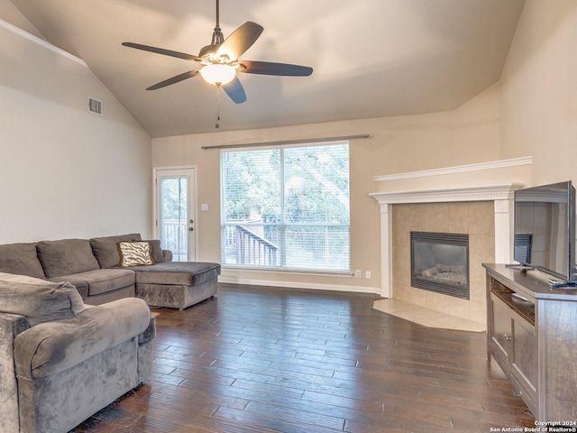 living room featuring a fireplace, dark hardwood / wood-style flooring, high vaulted ceiling, and ceiling fan