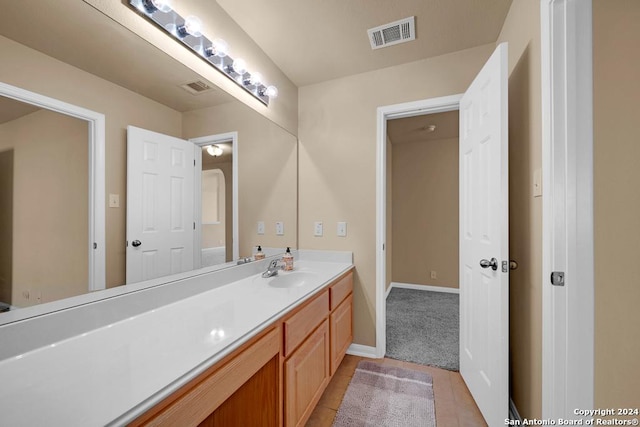 bathroom with tile patterned flooring and vanity