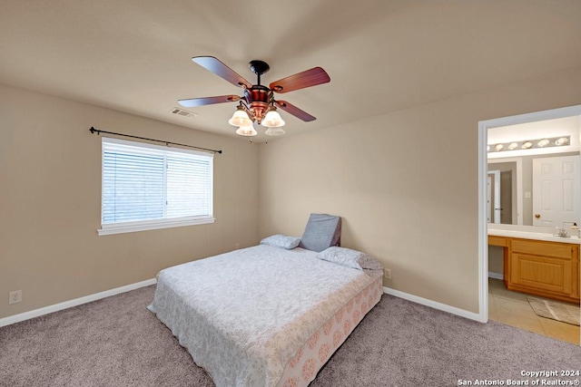 carpeted bedroom featuring ceiling fan, sink, and connected bathroom