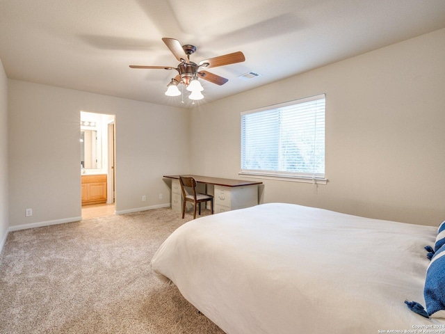 bedroom featuring connected bathroom, ceiling fan, and light carpet