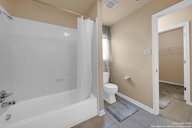 bathroom with tile patterned floors, toilet, and shower / bathtub combination with curtain