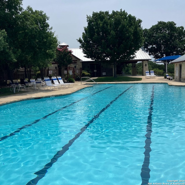 view of swimming pool with a patio area