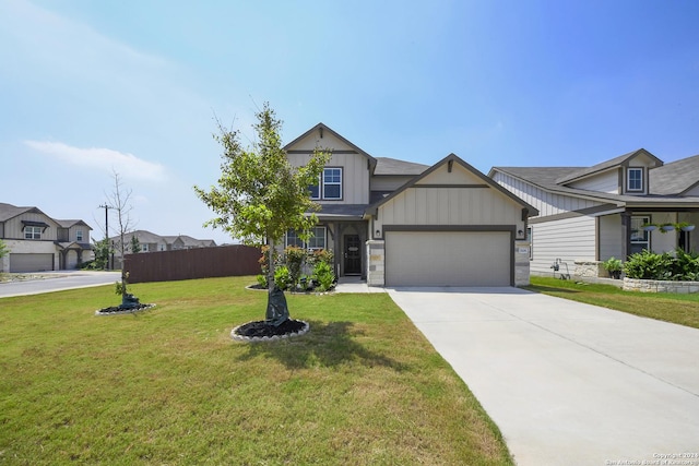 view of front of house with a front yard and a garage