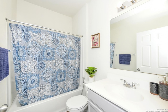 full bathroom featuring shower / bathtub combination with curtain, vanity, and toilet