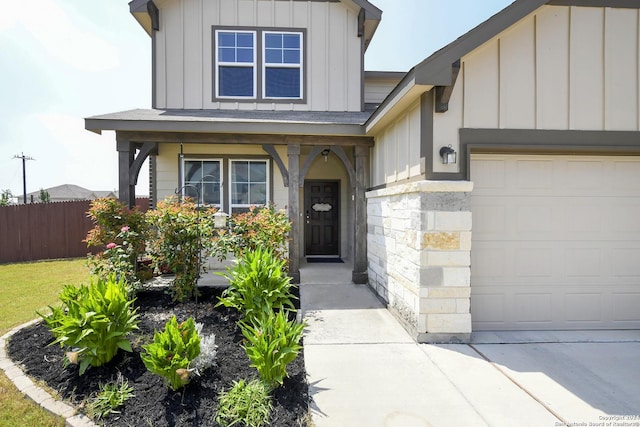 view of exterior entry with a garage