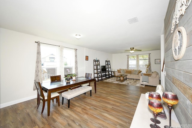 dining area featuring hardwood / wood-style floors and ceiling fan