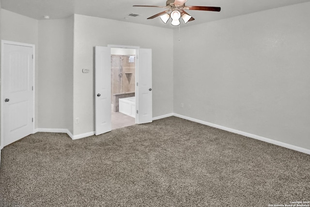 unfurnished bedroom with ensuite bath, ceiling fan, and carpet