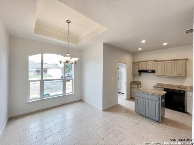 kitchen featuring a raised ceiling, a center island, a notable chandelier, and black dishwasher