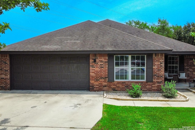 single story home with a garage