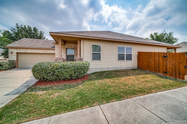 view of front of home featuring a garage and a front lawn