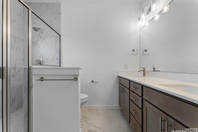 bathroom featuring vanity, toilet, and an enclosed shower