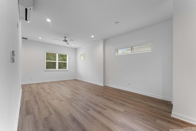 empty room with light hardwood / wood-style floors and ceiling fan