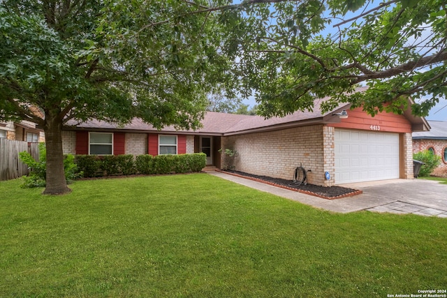 single story home featuring a garage and a front lawn