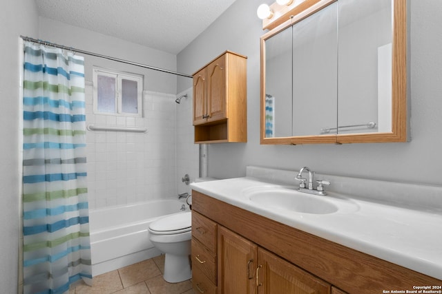 full bathroom featuring tile patterned floors, a textured ceiling, toilet, vanity, and shower / tub combo