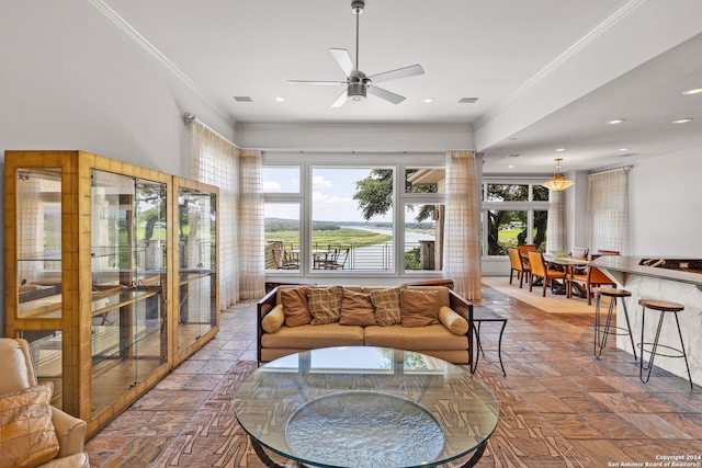 living room featuring crown molding and ceiling fan