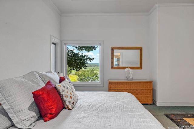 bedroom with dark carpet and crown molding