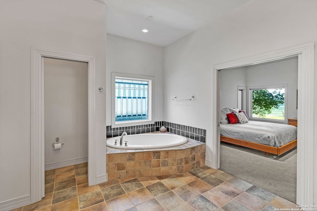 bathroom featuring tiled bath