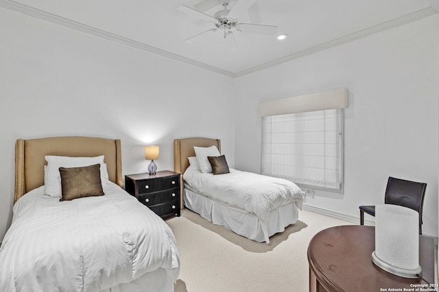 carpeted bedroom featuring ceiling fan and ornamental molding