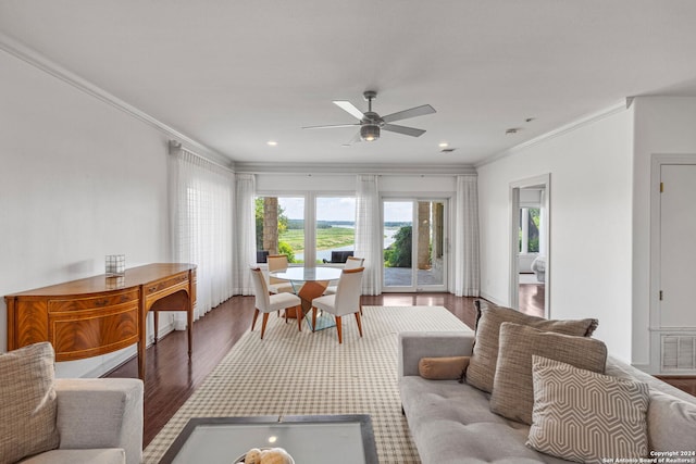 living room with wood-type flooring, ceiling fan, and ornamental molding