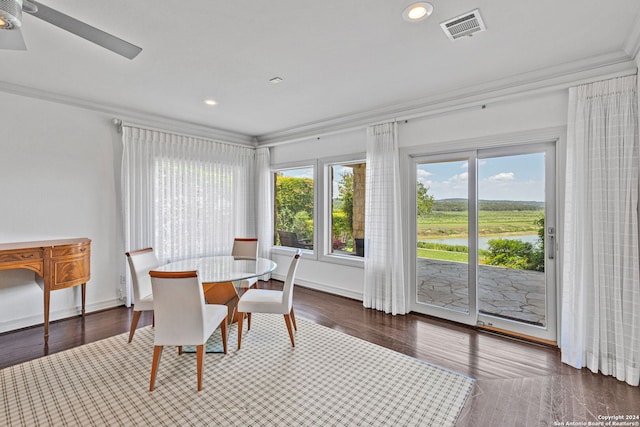 dining space featuring ceiling fan, dark hardwood / wood-style flooring, and crown molding