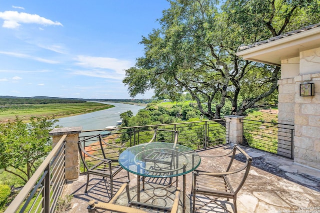 balcony featuring a water view