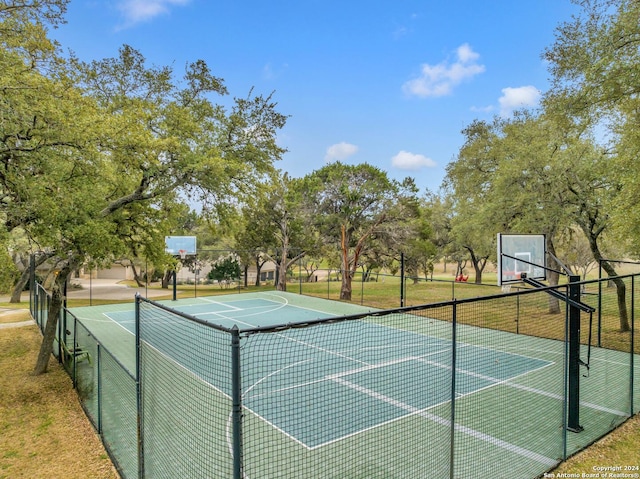 view of basketball court featuring a lawn