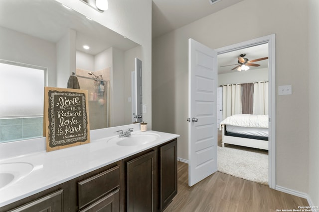 bathroom with ceiling fan, hardwood / wood-style floors, and double vanity