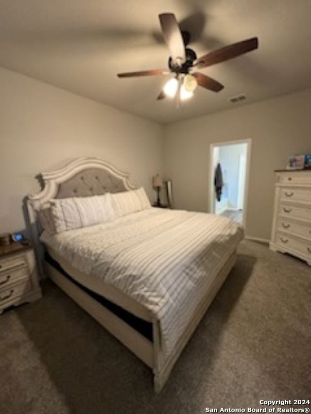 carpeted bedroom with ceiling fan