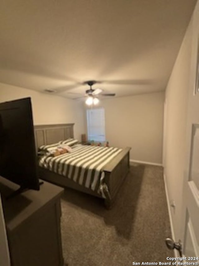 carpeted bedroom with ceiling fan