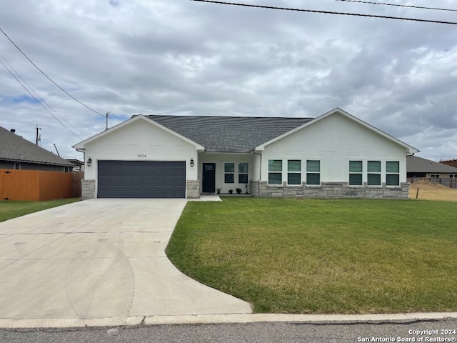 view of front of house featuring a garage and a front yard