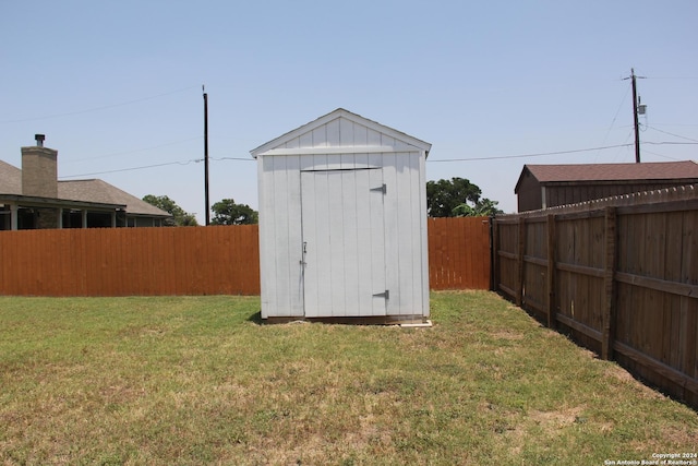 view of outbuilding featuring a yard