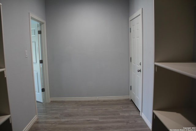 corridor featuring light hardwood / wood-style floors