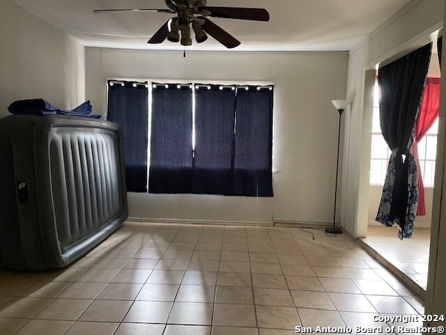 interior space featuring ceiling fan