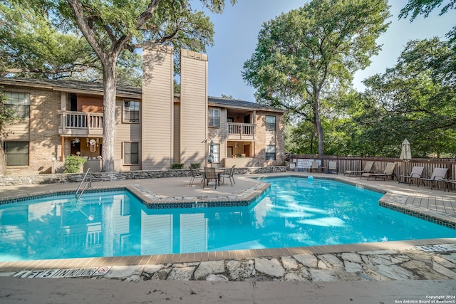 view of pool featuring a patio