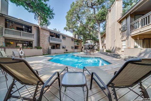 view of pool featuring a patio area