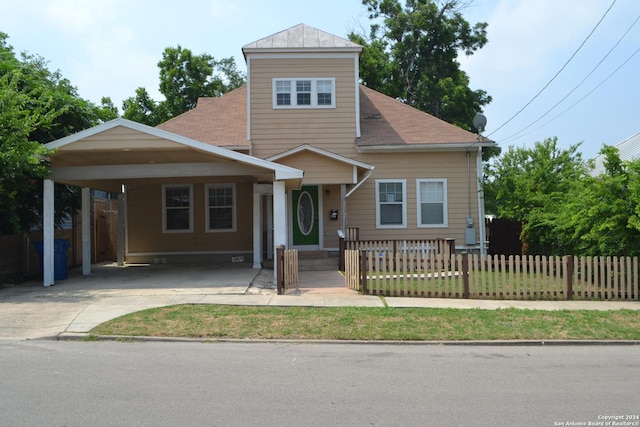 view of front of home with a carport