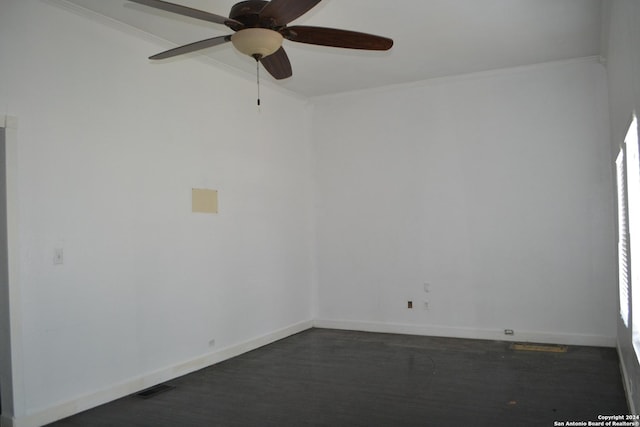 unfurnished room featuring ceiling fan and ornamental molding