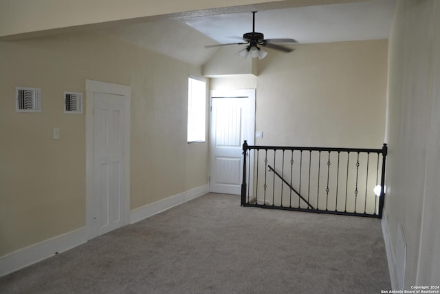 interior space with ceiling fan and lofted ceiling