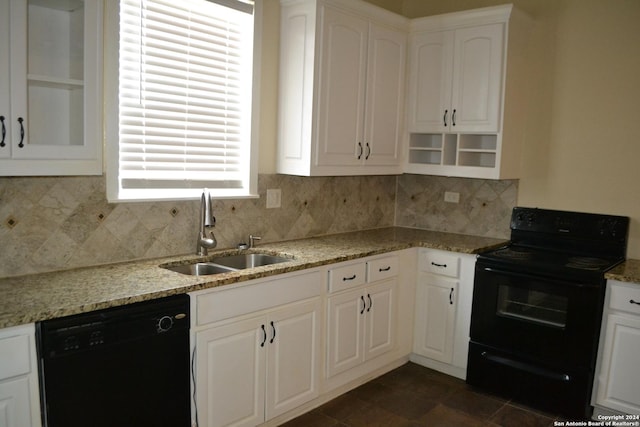 kitchen featuring backsplash, black appliances, white cabinets, sink, and light stone counters