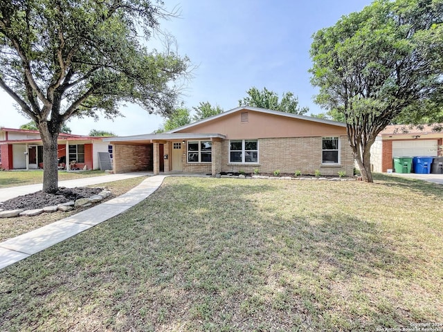 ranch-style home with a front lawn and a carport